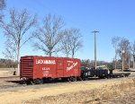 A couple of freight cars, including a Lackawanna Boxcar 